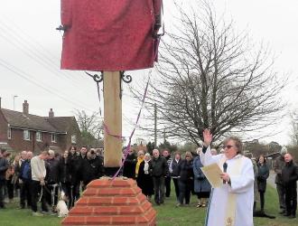 Revd' Judith Andrews blesses the sign